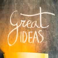 Free photo light falling over the great ideas text on chalkboard