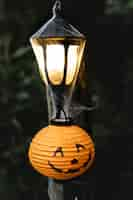 Free photo light post with spiderweb on halloween