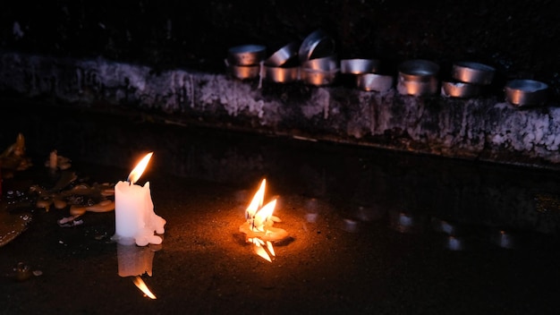 Lighted candles in a dark space Religious concept