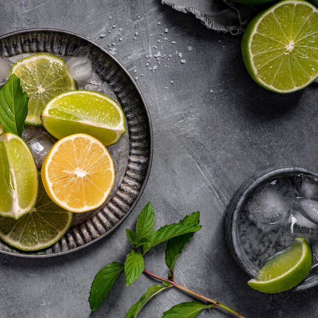 Lime and lemon slices on plate top view