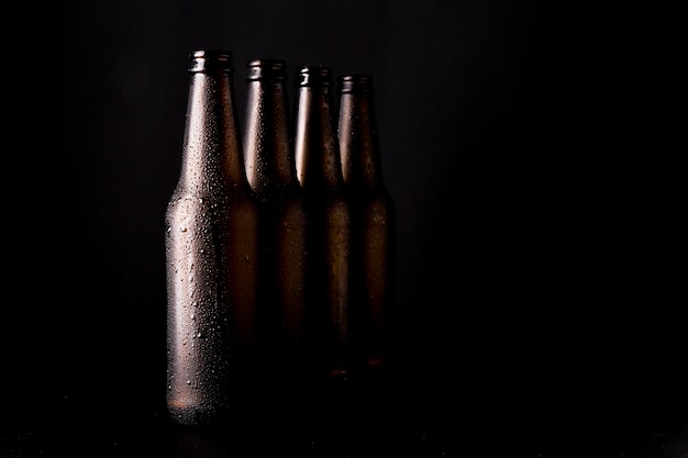 Line of black beer bottles