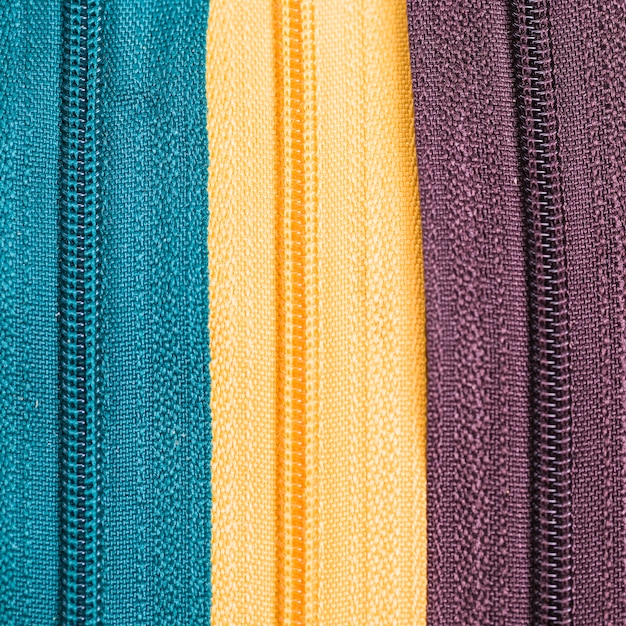 Free Photo line of three different zips