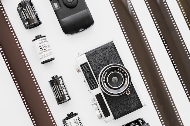 Free photo lines of cameras and cartridges near film