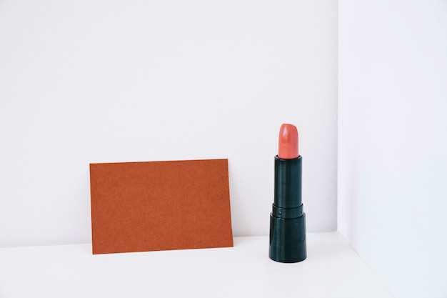 Free photo lipstick next to card