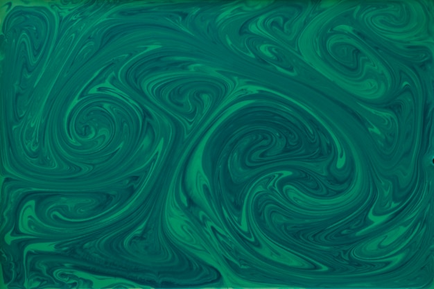 Liquid green and black paint textured marbling backdrop