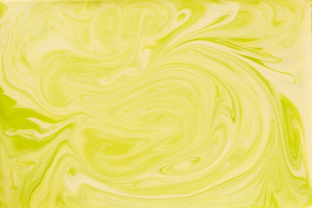 Liquid yellow paint marbling backdrop