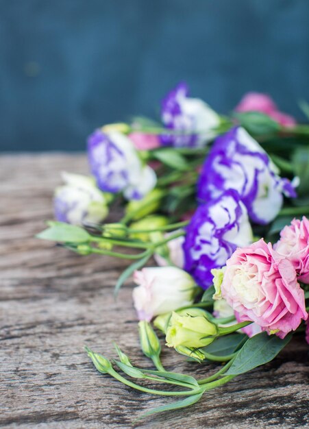 Lisianthus bouquet on a wooden table