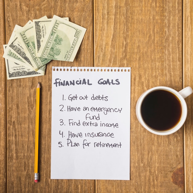 Free photo list of financial goals on table