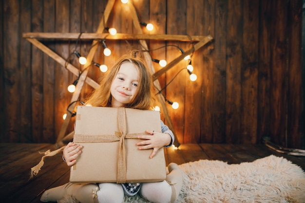 litle girl opening presents