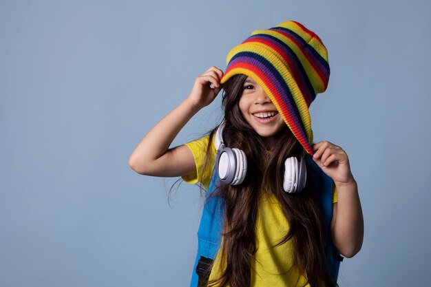 Little asian school girl with headphones portrait