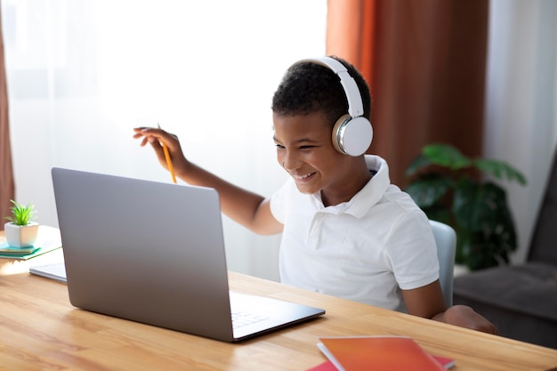 Little boy doing school online