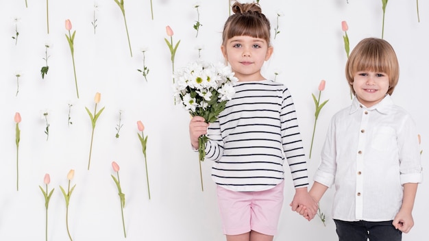 Free photo little boy and girl holding hands