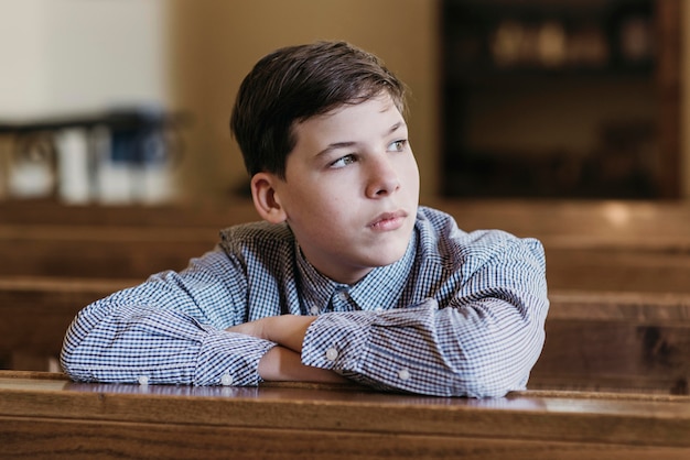 Little boy looking away in the church