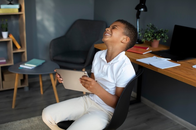 Little boy participating in an online class