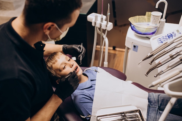 Free photo little boy patient at dentist