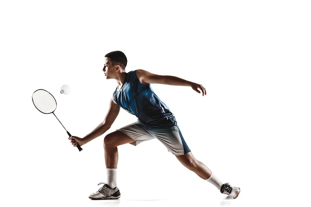 Little boy playing badminton isolated on white  background.