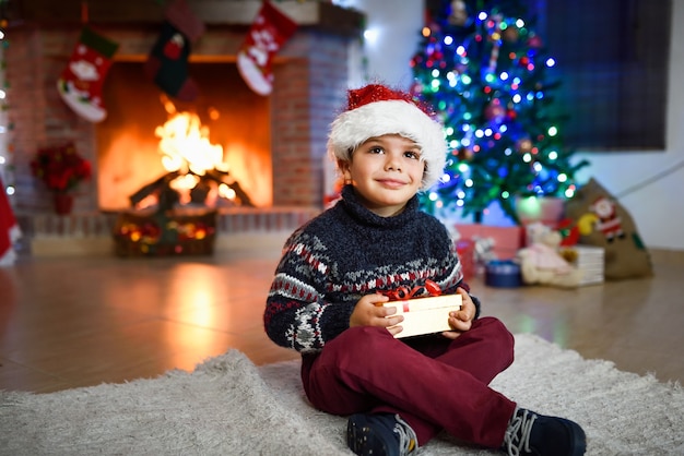 Little boy in a room decorated for christmas 