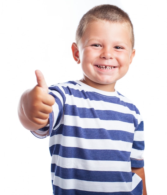 Little boy smiling with a thumbs up