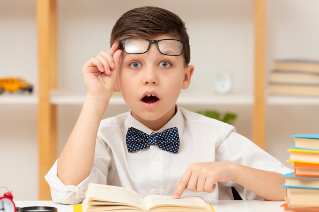 Little boy surprised of book content