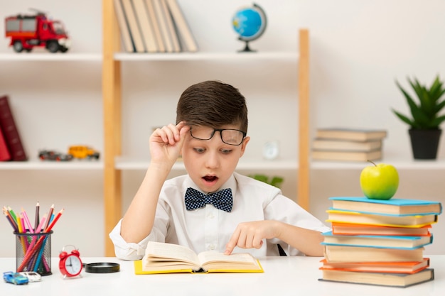 Little boy surprised by book content