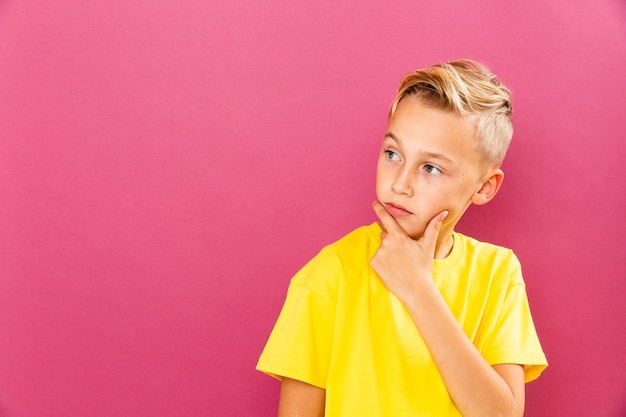 Little boy thinking pose with copy-space