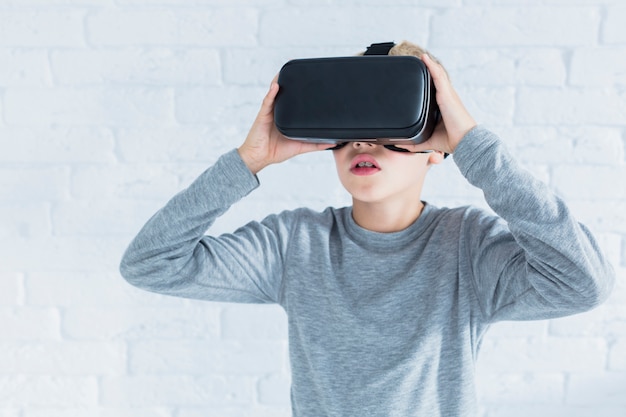 Little boy using virtual reality glasses