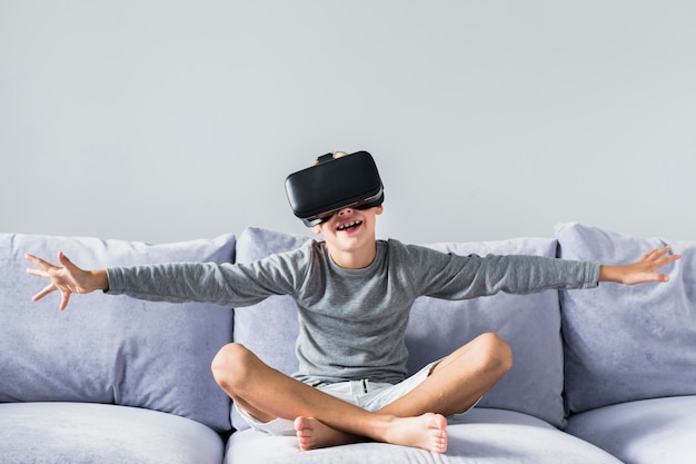 Little boy using virtual reality glasses