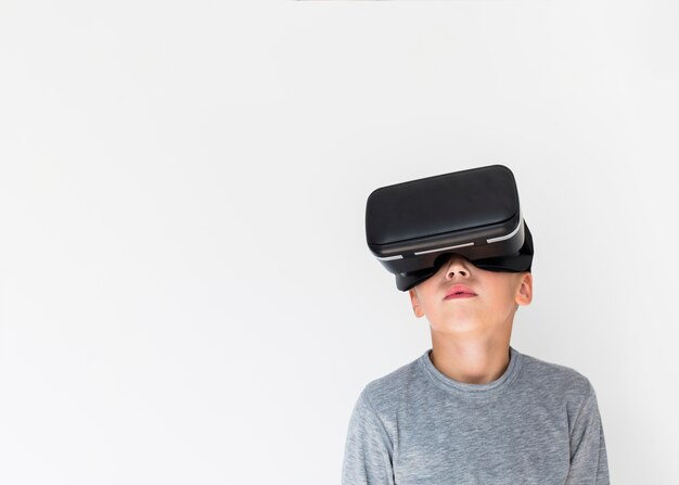 Little boy using virtual reality glasses