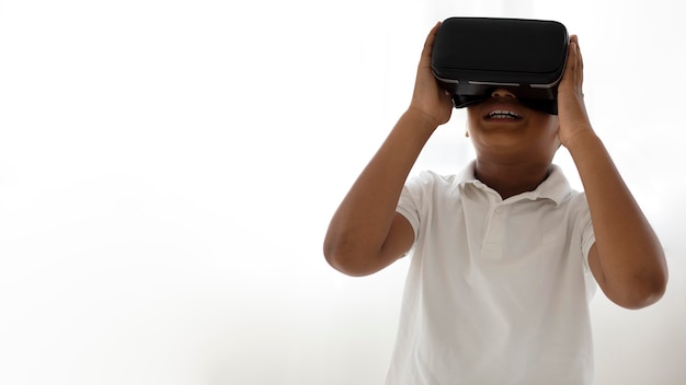 Little boy using virtual reality goggles