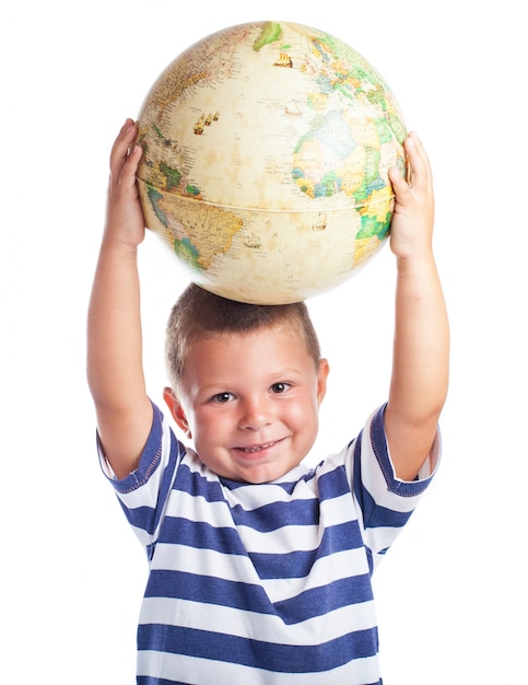 Free photo little boy with a globe on his head