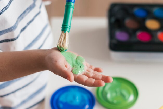 Little child painting like an artist