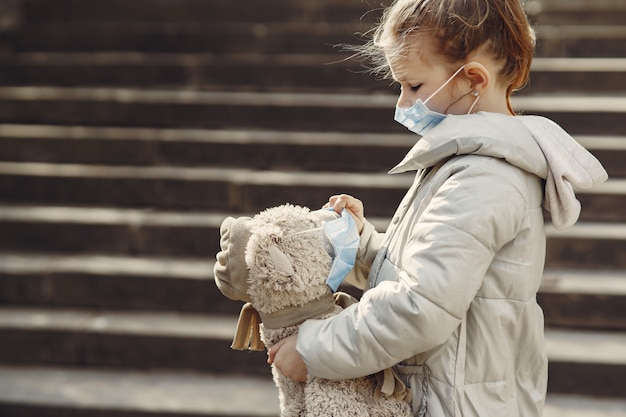 Free photo little child walks outside in a mask