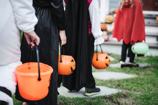 Free photo little children in halloween costumes