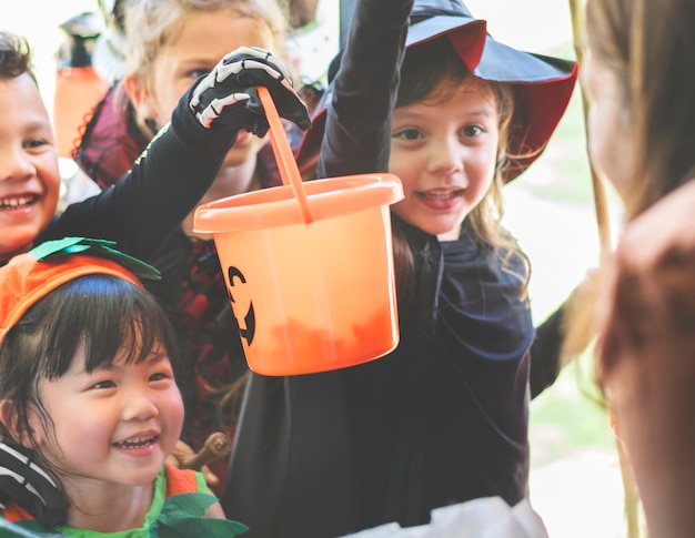 Little children trick or treating on Halloween