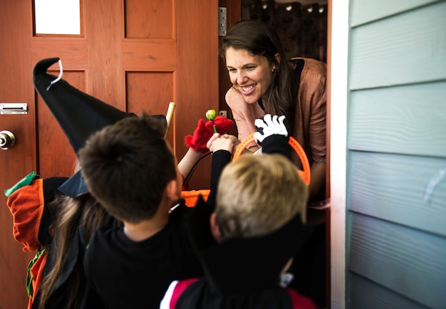 Free photo little children trick or treating on halloween