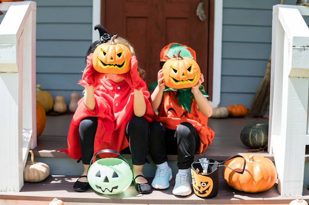 Little children trick or treating on Halloween