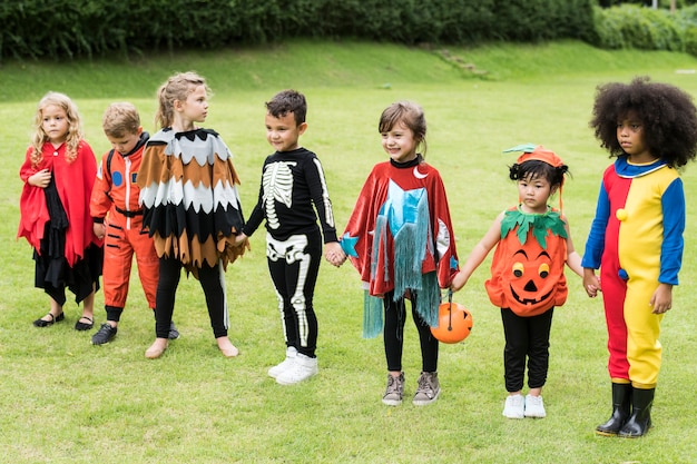 Free photo little children trick or treating on halloween