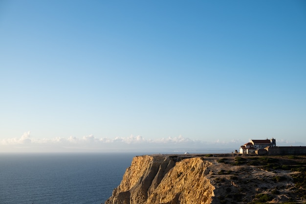 Free photo little church on the rocks in cabo espichel, portugal