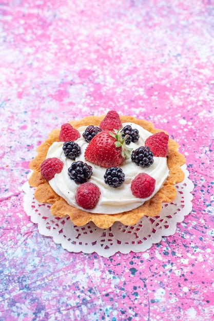 little creamy cake with berries on light,  cake biscuit berry sweet bake photo