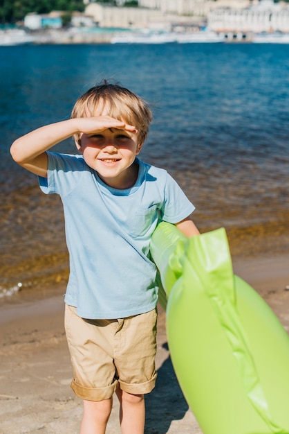 Little cute boy smiling at seaside