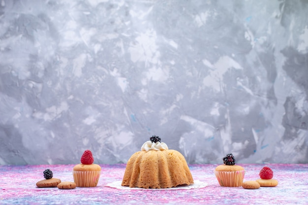 little delicious cake with cream along with berries on bright desk, cake biscuit berry sweet sugar photo