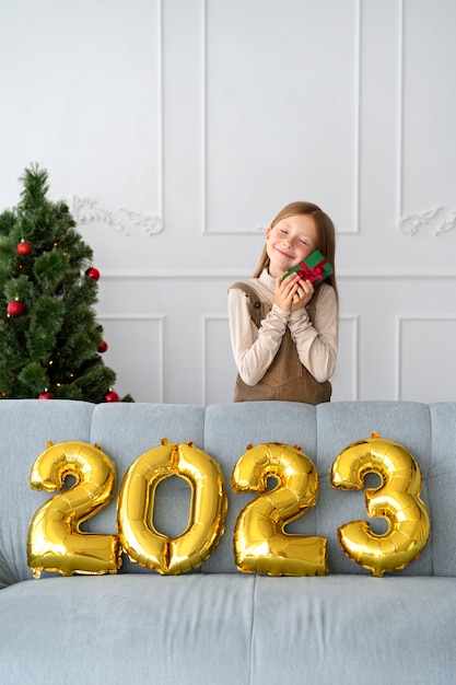 Little girl celebrating new years eve at home