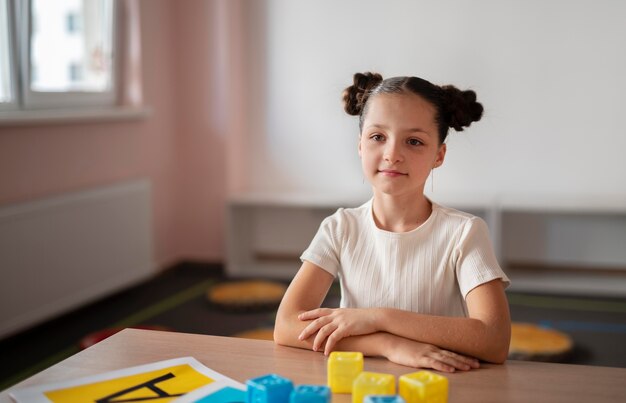 Little girl doing speech therapy at a clinic