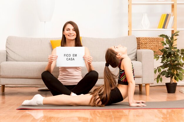 Little girl exercising with mom