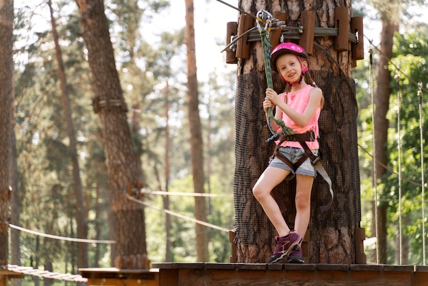 Free photo little girl having fun at an adventure park