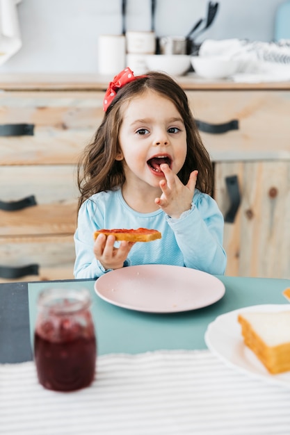 Little girl having her breakfast