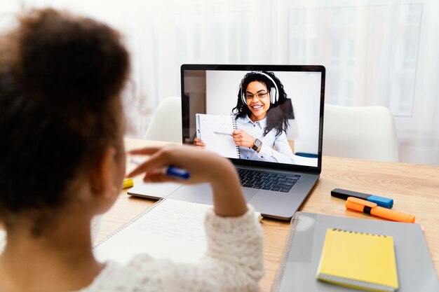 Little girl at home during online school