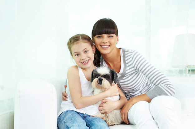 Little girl looking after her dog