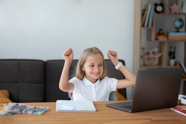 Little girl participating in online classes