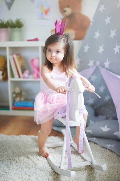 Little girl playing at her room